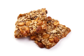 Cookies with nuts and seeds of peanut, sunflower seeds, sesame, linen, organic food, isolated on white background.