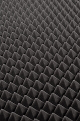 Studio sound proof foam pattern texture. Dark gray  triangular acoustic foam rubber. 