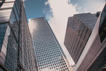 glass façade of tall skyscraper business buildings