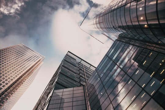 Fototapeta glass façade of tall skyscraper business buildings