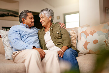 Happily retired ever after. Shot of a happy older couple relaxing on the sofa together at home. - Powered by Adobe