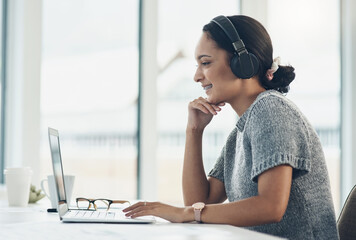 Playing a podcast in the background while she works