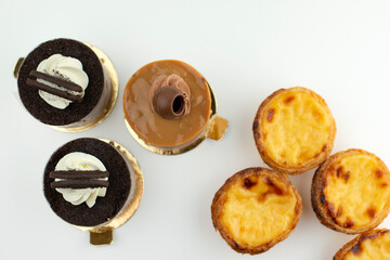 Baked round sweets top view on white background