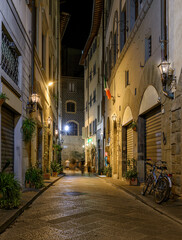 Night view of narrow street in Florence, Tuscany, Italy. Architecture and landmark of Florence. Cityscape of Florence