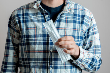 young man holding pcr covid-19 self test