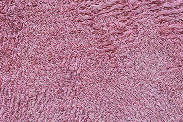 background in the form of a fleecy surface of light burgundy color