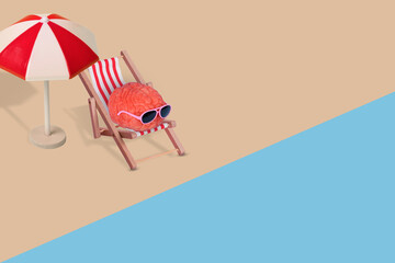 Creative funny composition made of human brain with sunglasses, relaxing on the beach.