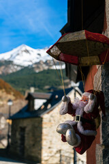 Santa Claus decoration with snow mountain in the back - Sallent de Gallego, Valle de Tena valley, Huesca, Aragon, Spain