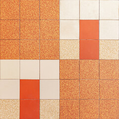 Photograph of traditional indochina style tiles in orange, white and beige color