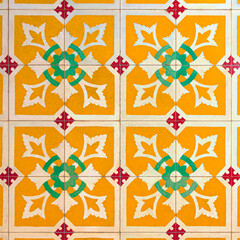 Photograph of traditional vietnam tiles in red, green, white and yellow color