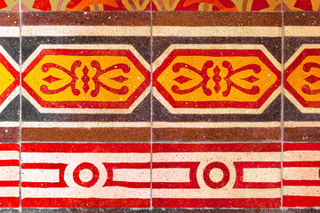 Photograph of traditional vietnam tiles in red,white black and yellow color