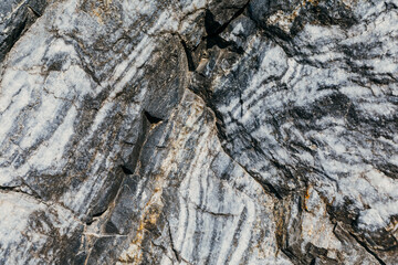 Marble quarry, marble rocks in the wild. Natural stone. Ancient marble quarry, marble rocks in the wild. Pieces of marble mountain. Tourism and travel