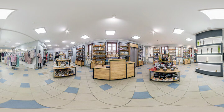 MINSK, BELARUS - MAY, 2021: spherical seamless hdr 360 panorama in interior of shop of clothes and shoes with shelves fabrics in textiles industrial goods and souvenirs in equirectangular projection,