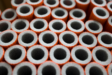 Foam pipe insulation texture background . Selective focus .