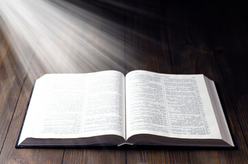 Obraz premium Bible. Open book. Light from a book. Old antique book. Magic, fairy tale.