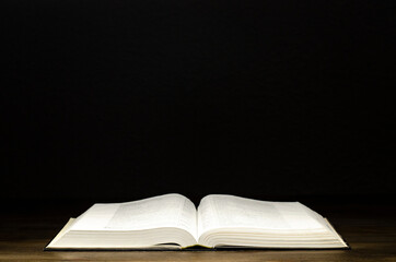 Bible. Open book. On a wooden background. Holy Bible.