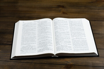 Bible. Open book. On a wooden background. Holy Bible.