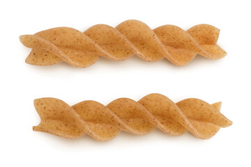 Wolegrain fusilli pasta from durum wheat isolated on white background with clipping path and full depth of field. Top view. Flat lay.