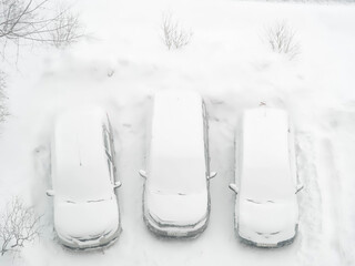 Cars under freshly fallen snow