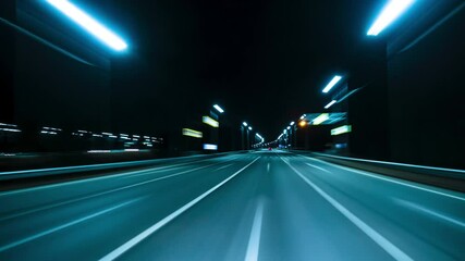 Motion timelapse of a speedy night drive near a big city. View from the car window to the road with light trails from vehicles and street lights. Hyperlapse Road Trip Dashcam POV - Powered by Adobe