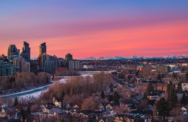 Sunrise Over The City And Mountains