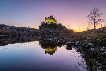 View of the beautiful Almourol castle located on a small island on the middle of the Tagus river,...