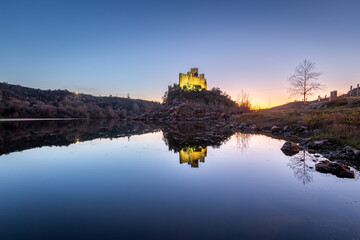 View of the beautiful Almourol castle located on a small island on the middle of the Tagus river,...