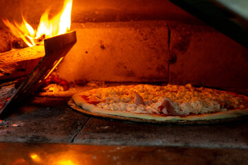 Pizza in a wood-fired oven