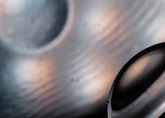 Abstract macro photo of soap bubbles on the water surface