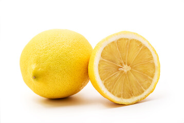Lemons on white background. Halfs of lemon and whole lemon, with little shadow. Yellow lemons isolated on white background with clipping path included.
