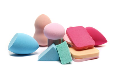 Beauty blender pile, powder puff, colorful cosmetic makeup applicator sponge tools set isolated on white 