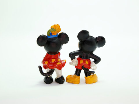 Mickey Mouse and Minnie retro toys figures. Plastic doll. Vintage. Isolated. Cartoon character from Walt Disney Pictures Studios. Mickey is Minnie Mouse's boyfriend. Classic Mickey. Back view.