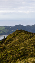 One person discovering  the miradouro of Boca de Inferno in Sao Miguel, Azores