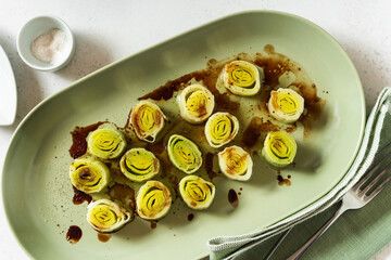 French leek with vinaigrette and balsamic sauce on the table