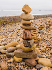 Stone stack sculpturers on Lindisfarne Beach, Holy Island, Northumberland, Uk