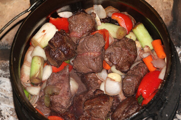 Poyke - heavy iron pot uses for cooking on open fire or in oven. High quality photo