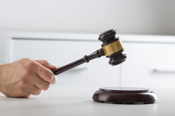 Lawyer working with contract papers and wooden gavel on tabel in courtroom. justice and law ,attorney, court judge concept.