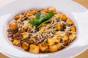 italian potato gnocchi with bolognese sauce. close up