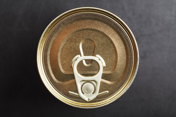 Metal lid with a ring from a tin can
