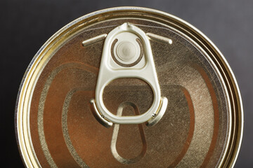 Metal lid with a ring from a tin can