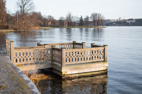 Beautiful wooden pier or jetty on the riverbanks of a swedish lake.