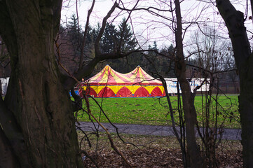 colourful circus tent on meadow 