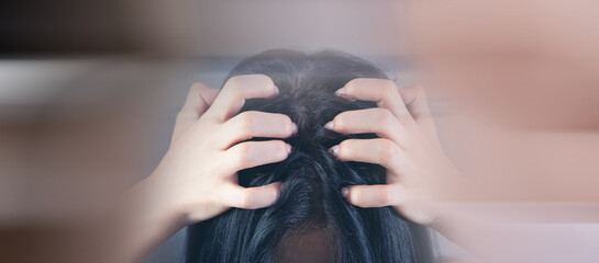 a young woman has an itchy head
