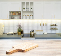 Fototapeta na wymiar Wood table top on blur kitchen room