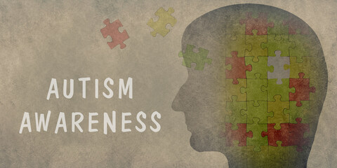 Autism awareness is standing on the background, head with puzzle pieces, asperges syndrome, psychology