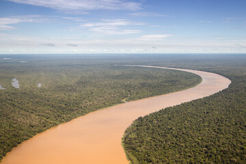 Purus river winding through the green and humid forest. An aerial view of the curve of a very large...