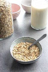 Breakfast cereals. Uncooked oatmeal. Raw oat flakes.