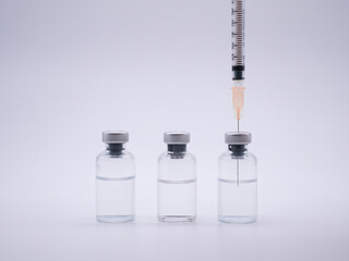 Obraz na płótnie Canvas Reffilling syringe with vaccine isolated on white background