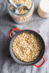 Breakfast cereals. Uncooked oatmeal. Raw oat flakes.