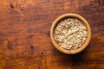 Breakfast cereals. Uncooked oatmeal. Raw oat flakes.